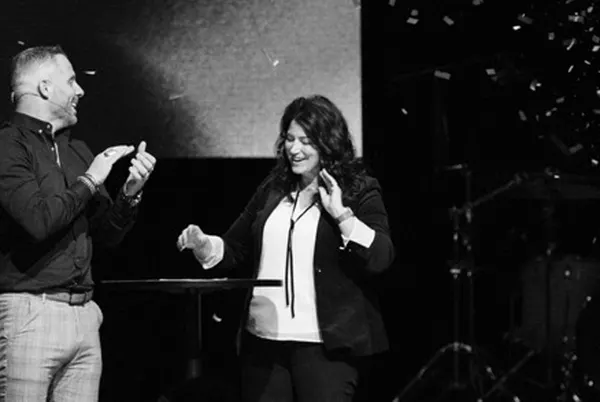 Pastors Jeanne and Jarrett on stage