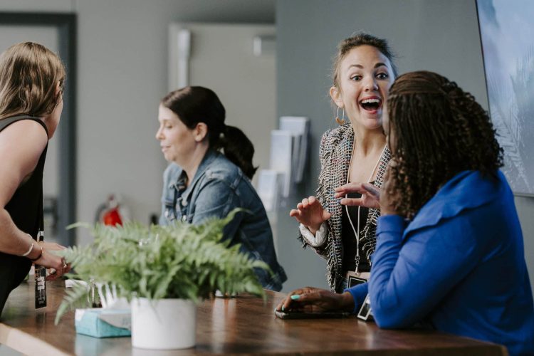 Team members welcoming guests at the Connection Desk