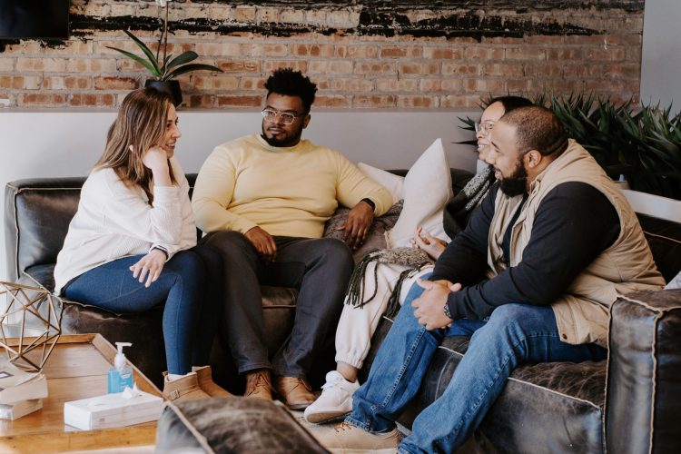 A small group talking together on couches at Soul City Church
